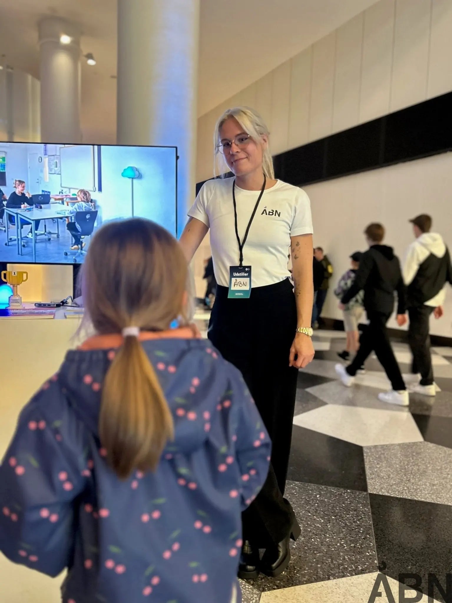 a group of people standing around an airport 