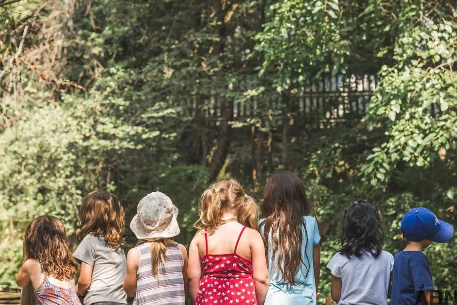 a group of people sitting on a park bench 